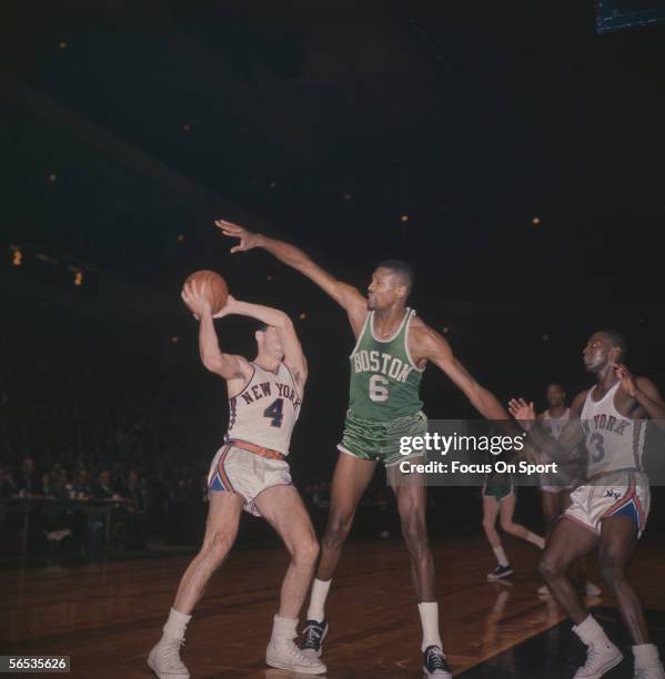 Bill Russell of the Boston Celtics blocks a shot by the New York Knicks circa the 1960's during a game.