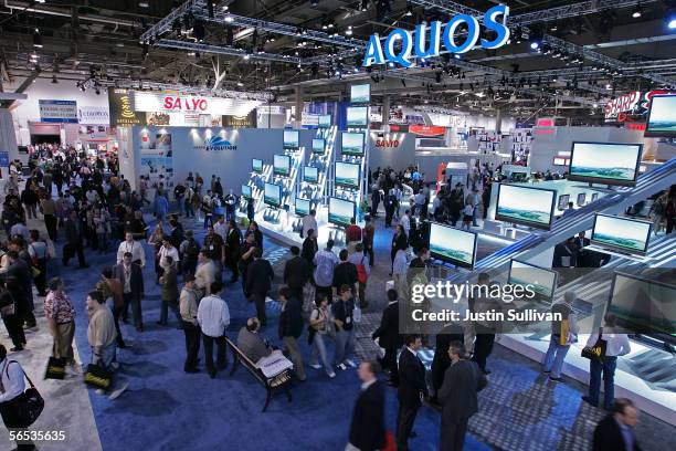 Attendees walk on the floor of the 2006 Consumer Electronics Show January 6, 2006 in Las Vegas, Nevada. The 1.6 million square foot consumer...