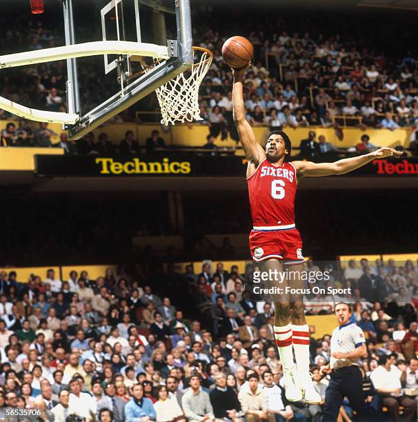 Julius Erving of the Philadelphia 76ers dunks circa the 1970's during a game.
