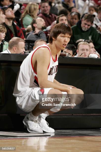 Ha Seung-Jin of the Portland Trail Blazers waits to enter the game against the Washington Wizards at the Rose Garden on December 18, 2005 in...