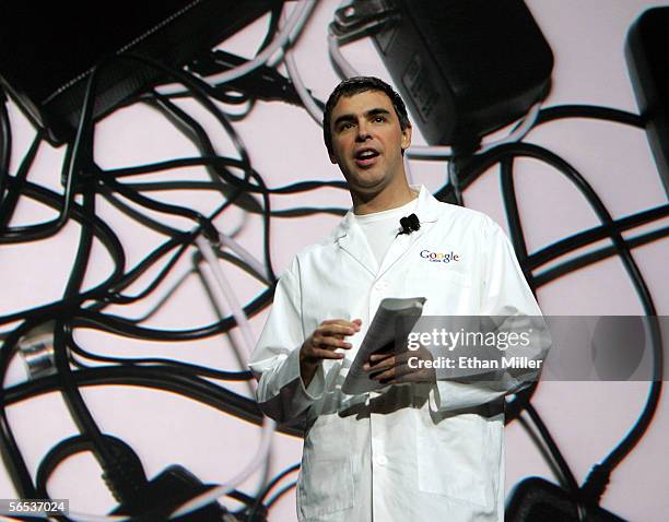 Google co-founder Larry Page stands in front of an image of jumbled adapters and power cords as he delivers a keynote address at the International...