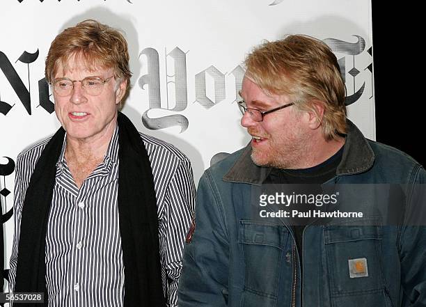 Actors Robert Redford and Philip Seymour Hoffman talk as they pose for photographers prior to the Times Talk: Special Edition conversations at the...