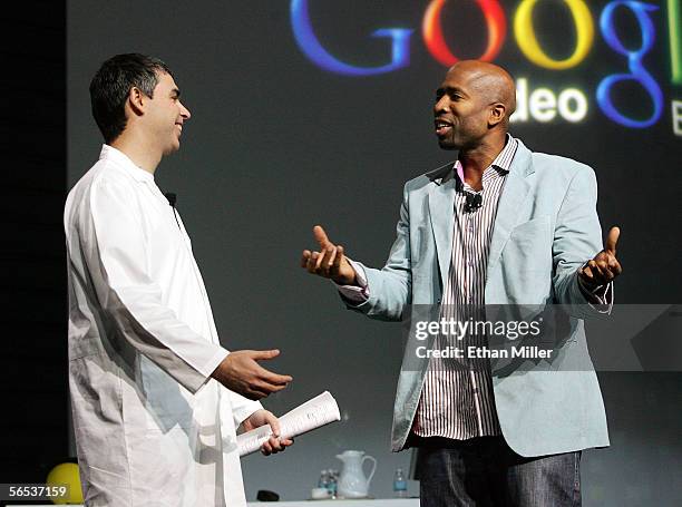 Google co-founder Larry Page talks with former NBA player Kenny Smith during Page's keynote address at the International Consumer Electronics Show...