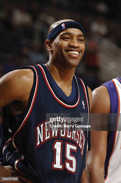 Vince Carter of the New Jersey Nets smiles as he stands on the court during a game against the Phoenix Suns at America West Arena on November 25,...