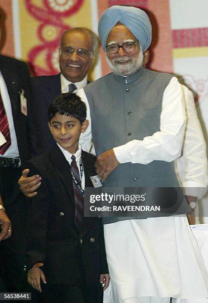 Indian Prime Minister Manmohan Singh greets Thailand based Master Ajay Puri, a young web designer during the inauguration of the "Pravasi Bharatiya...