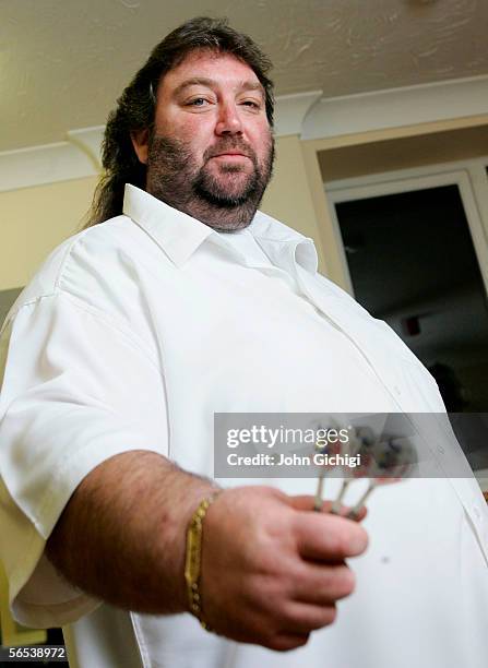 Andy Fordham of England prepares for his match against Simon Whitlock od Australia during the BDO World Darts Championships on January 7, 2006 at the...