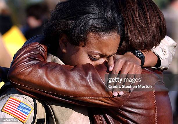 Army First Lt. Alisha Vanghn is greeted by her friend First Lt. Shandale Hall during a welcome home ceremony for 330 soldiers from the 3rd Infantry...