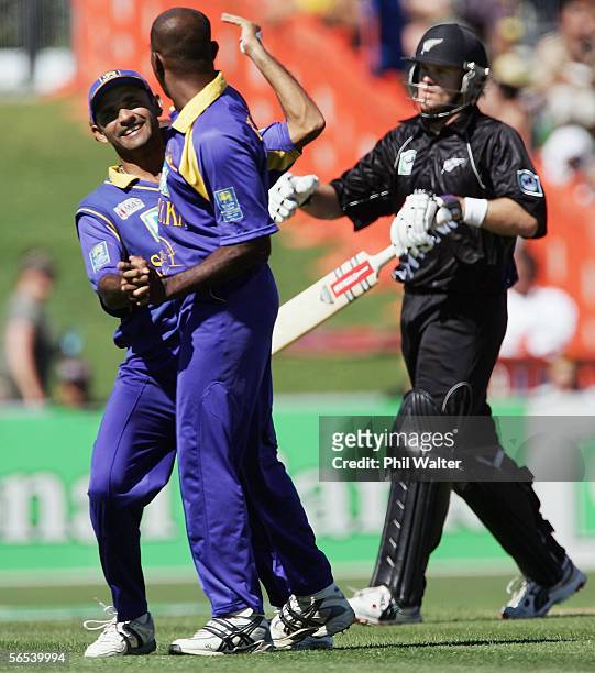 Marvan Atapattu of Sri Lanka congratulates Ruchira Perrira on his wicket of Lou Vincent of New Zealand during the fourth one day international match...