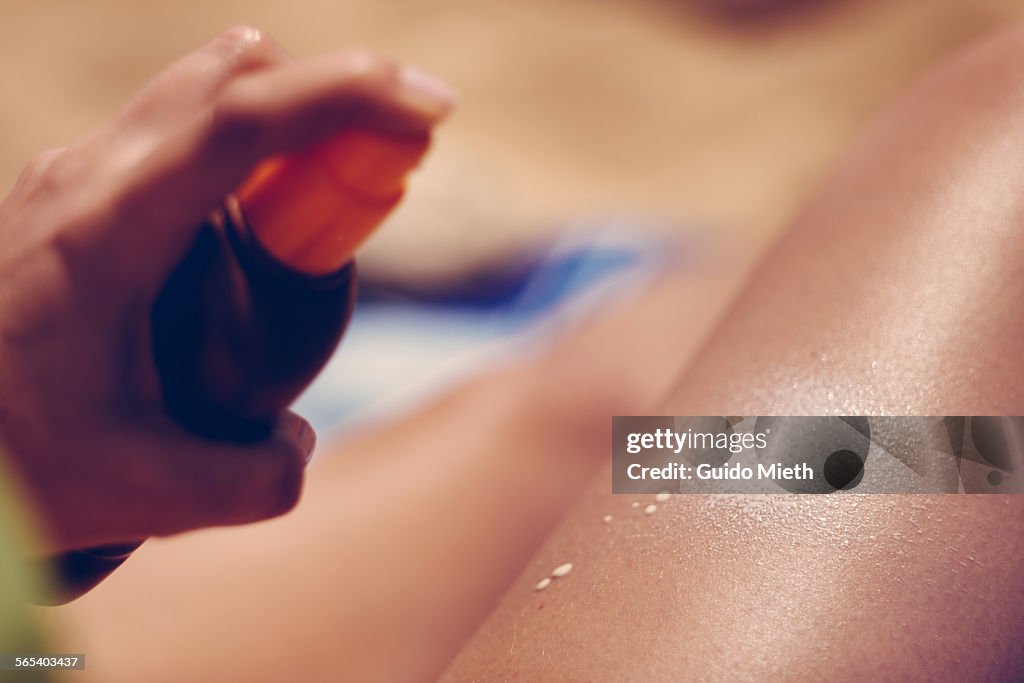 Woman using suncream