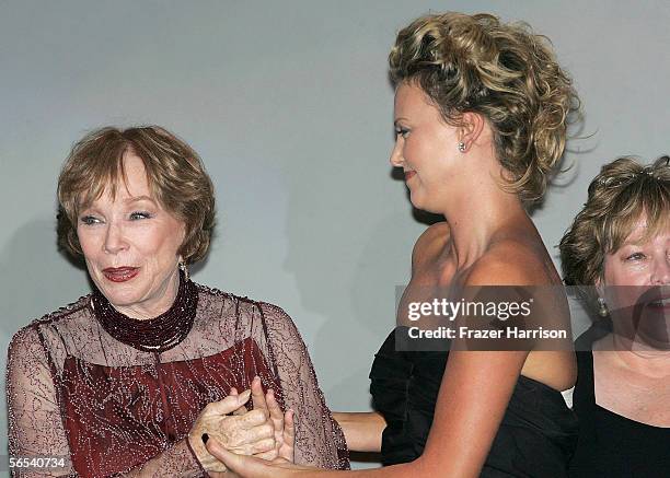 Honorees Shirley MacLaine and Charlize Theron talk onstage at the 17th Annual Palm Springs International Film Festival Gala at the Palm Springs...