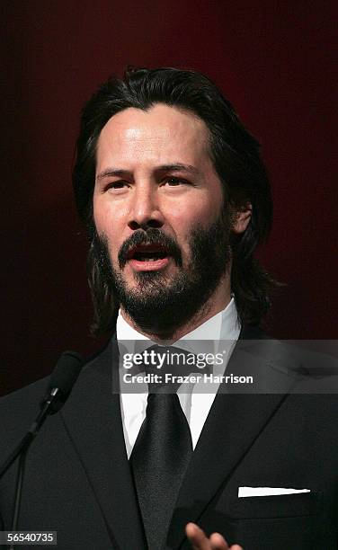 Actor Keanu Reeves presents the Desert Palm Achievement Award to Charlize Theron onstage at the 17th Annual Palm Springs International Film Festival...