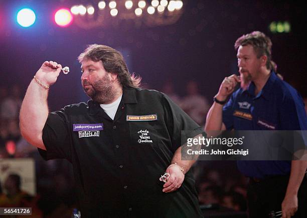 Andy Fordham in action against Australia's Simon Whitlock during the BDO World Darts Championships at the Lakeside on January 8 Frimley Green,...