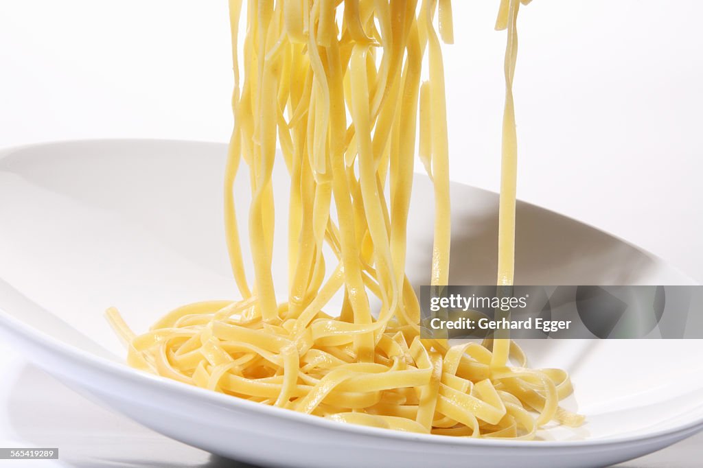 Fettuccini pasta being served