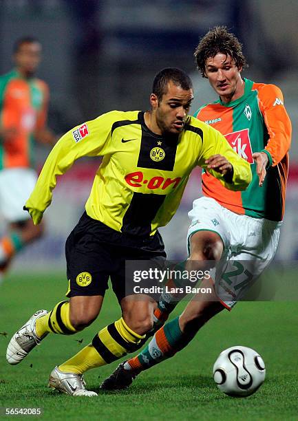 Christian Schulz of Bremen challenges David Odonkor of Dortmund during the Efes Pilsen Cup match between Borussia Dortmund and Werder Bremen at the...