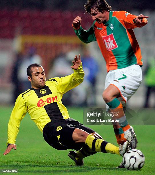 David Odonkor of Dortmund challenges Christian Schulz of Bremen for the ball during the Efes Pilsen Cup match between Borussia Dortmund and Werder...