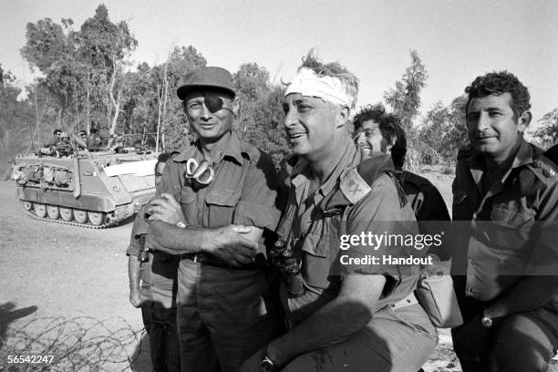 Israeli army Southern Command General Ariel Sharon with Defense Minister Moshe Dayan during the Yom Kippur War in October 1973 on the western bank of...