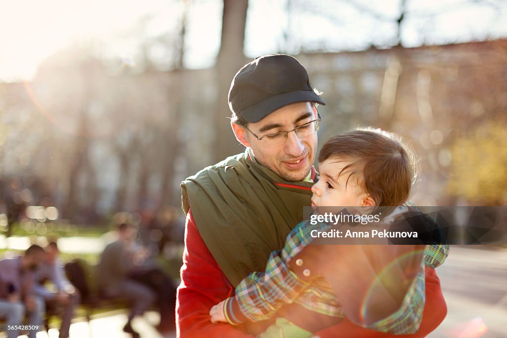 Father holding toddler boy