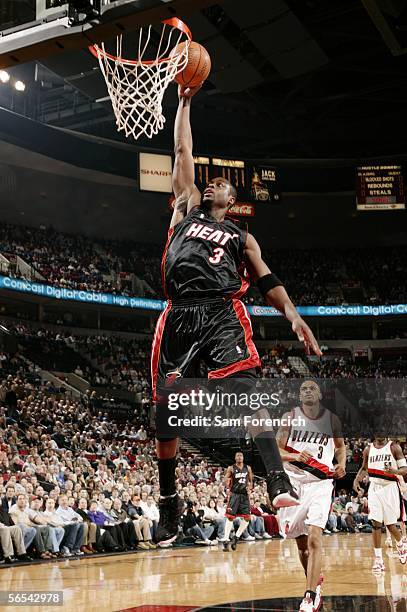 Dwyane Wade of the Miami Heat dunks the ball during a game against the Portland Trail Blazers on January 8, 2006 at the Rose Garden Arena in...