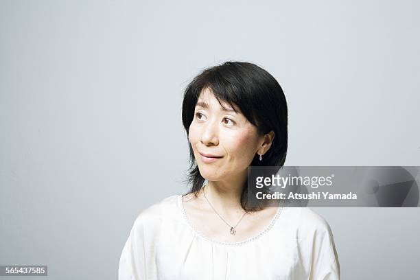 portrait of middle aged woman,smiling - mature women portrait asian bildbanksfoton och bilder
