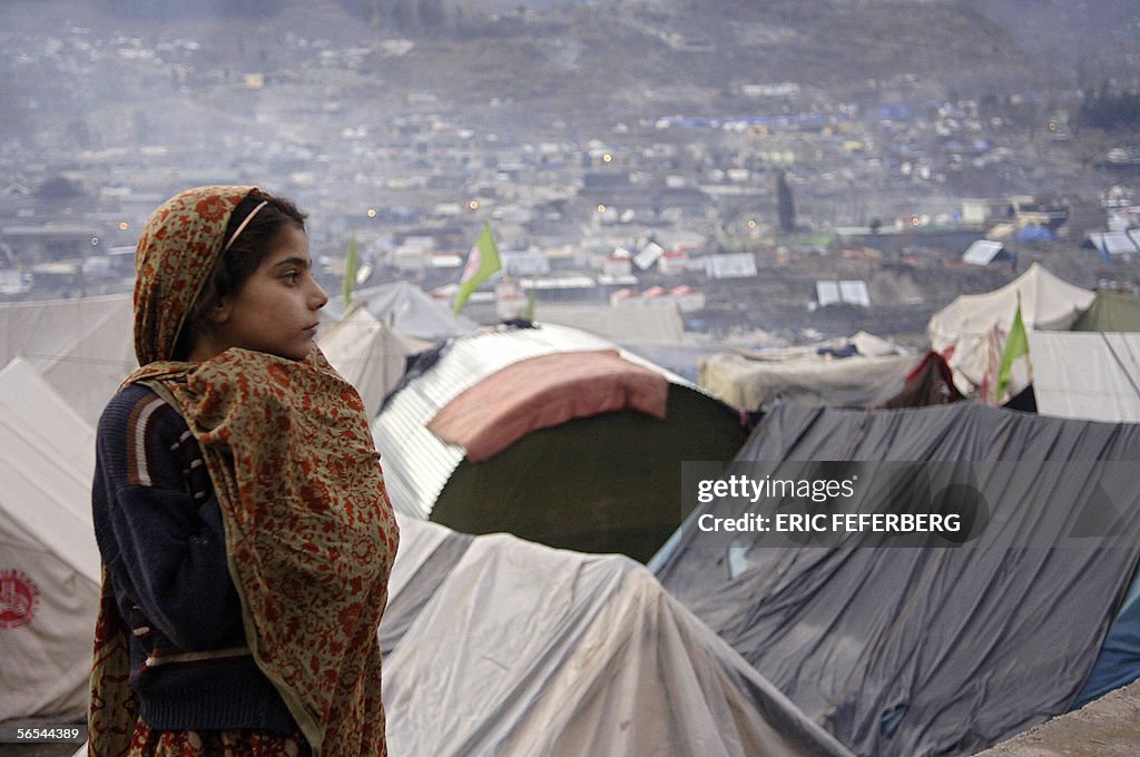A Pakistani earthquake survivor watches