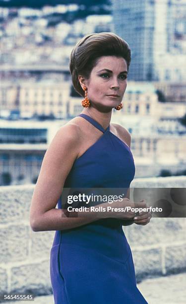 American actress and Princess of Monaco, Grace Kelly pictured wearing a blue evening dress with halterneck in Monte Carlo circa 1968.