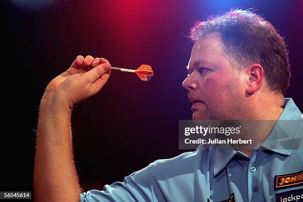 Raymond Van Barneveld of Holland in action against Brian Sorensen of Denmark during the BDO World Darts Championships at the Lakeside on January 9...