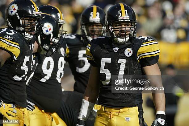 Linebackers James Farrior and Joey Porter of the Pittsburgh Steelers look to the bench as the defense huddles during a game against the Detroit Lions...