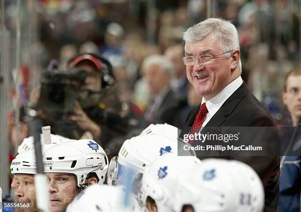 Head coach Pat Quinn of the Toronto Maple Leafs smiles as he looks on during the game against the Ottawa Senators on December 17, 2005 at the Corel...