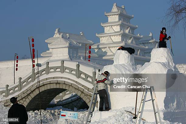 Artists make a snow sculpture at the Sun Island, part of the 22nd Harbin International Ice and Snow Festival on January 10, 2006 in Harbin,...