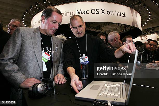 Intel CEO Paul Otellin and Apple CEO Steve Jobs look at a new MacBook Pro laptop with Intel Core Duo processor during the 2006 Macworld January 10,...