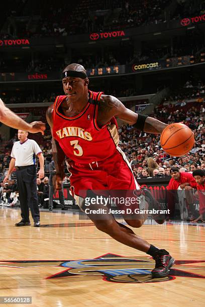 Al Harrington of the Atlanta Hawks drives against the Philadelphia 76ers December 14, 2005 at the Wachovia Center in Philadelphia, Pennsylvania. The...