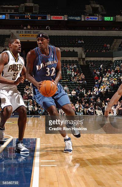 Andray Blatche of the Washington Wizards drives past Samaki Walker of the Indiana Pacers during a game at Conseco Fieldhouse on December 8, 2005 in...