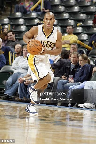 Eddie Gill of the Indiana Pacers moves the ball up court during a game against the Washington Wizards at Conseco Fieldhouse on December 8, 2005 in...