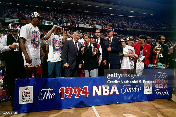 Commissioner David Stern is interviewed by Bob Costas as the Houston Rockets celebrate defeating the New York Knicks in game 7 of the 1994 NBA Finals...