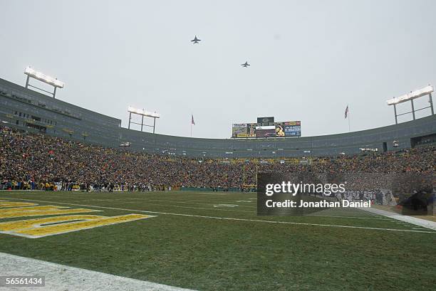 Military aircraft fly over Lambeau Field prior to the game between the Green Bay Packers and the Seattle Seahawks on January 1, 2006 at in Green Bay,...
