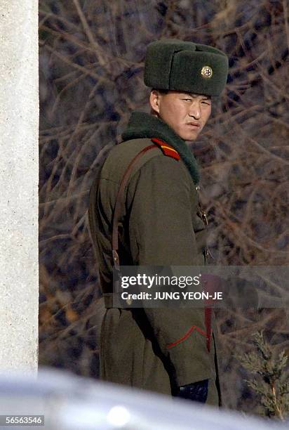 North Korean soldier stands guard at the border village of Panmunjom, 11 January 2006, in the Demilitarized Zone dividing North and South Korea....