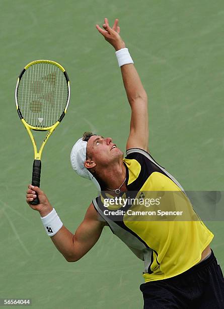 Lleyton Hewitt of Australia serves during his match against Jurgen Melzer of Austria during day four of the Medibank International at the Sydney...