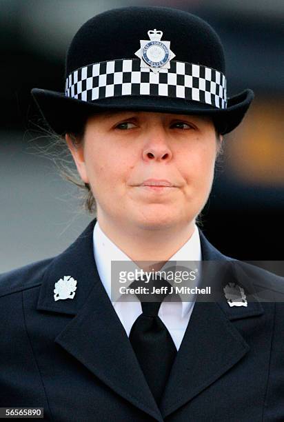 Police officer Teresa Milburn walks behind the funeral cortege of Police Constable Sharon Beshenivsky at Bradford South Police Headquarters on...