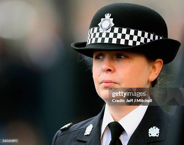 Police officer Teresa Milburn walks behind the funeral cortege of Police Constable Sharon Beshenivsky at Bradford South Police Headquarters on...