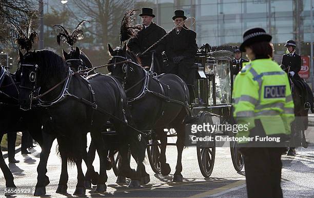 Police officers pay their respects to the funeral cortege of Police Constable Sharon Beshenivsky on January 11, 2006 in Bradford, England. PC...