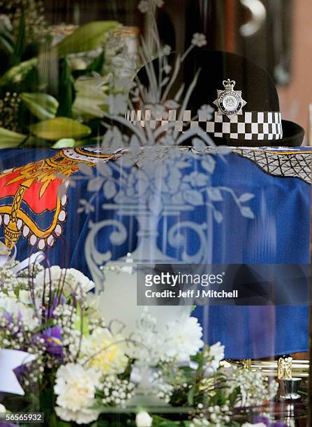Police Constable Sharon Beshenivsky's hat sits on her coffin during her funeral on January 11, 2006 in Bradford, England. PC Beshenivksy was killed...