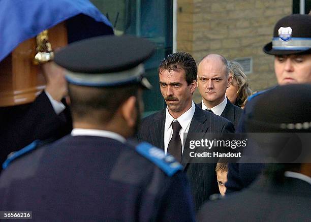 Paul Beshenivsky, the husband of Police Constable Sharon Beshenivsky and his son Joshua arrive for her funeral of at Bradford Cathedral on January...