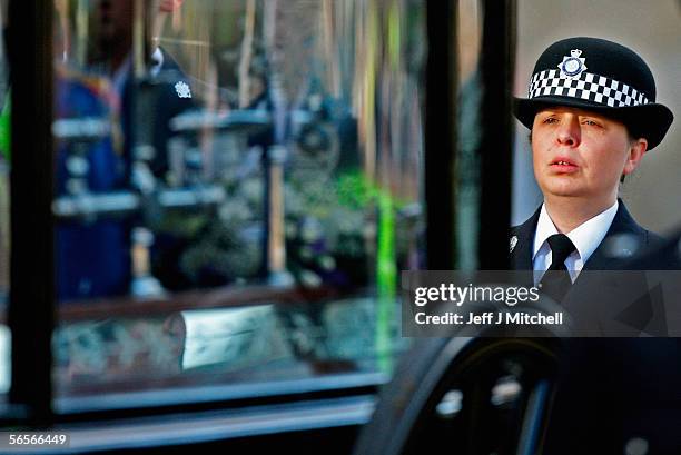 Police officer Teresa Milburn walks behind the funeral cortege of Police Constable Sharon Beshenivsky at Bradford South Police Headquarters on...