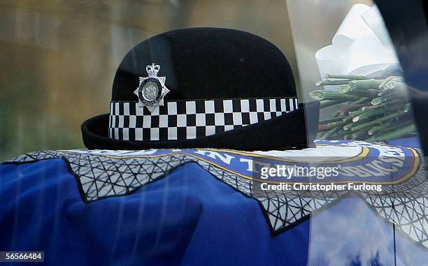 The hat of murdered Police Constable Sharon Beshenivsky is layed on top of her coffin as it leaves Bradford Cathedral on January 11, 2006 in...