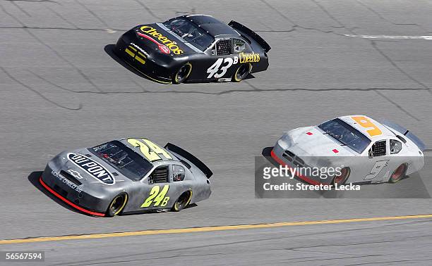 Jeff Gordon, driver of the Dupont Chevrolet; Kasey Kahne, driver of the Dodge Dealers Dodge; and Bobby Labonte, driver of the Cheerios Dodge are...