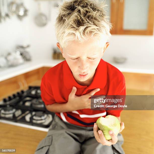 young boy choking - choking food stock-fotos und bilder