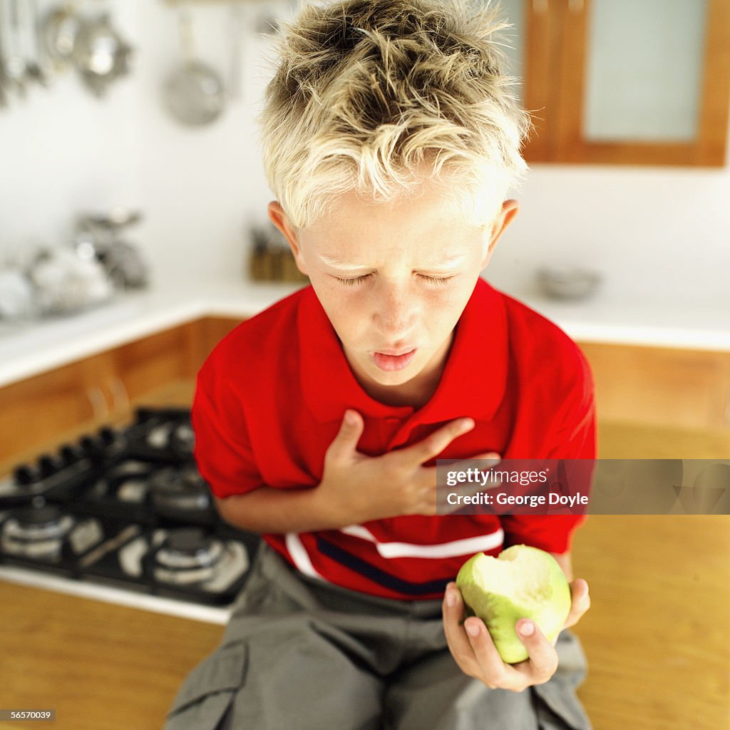 Young boy choking