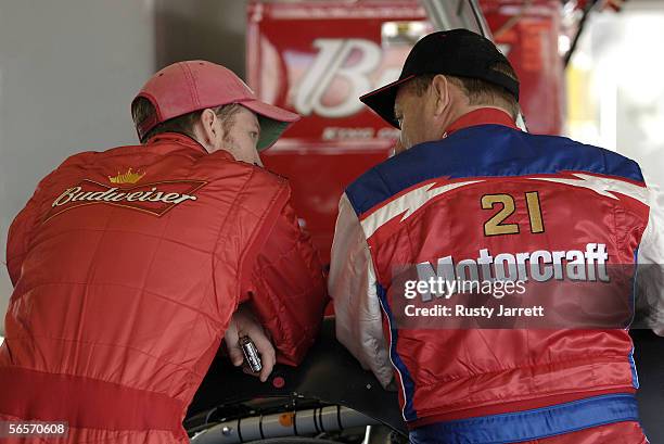 Dale Earnhardt Jr. , driver of the Budweiser Chevrolet speaks with Kenny Schrader, driver of the Motorcraft Ford, during NASCAR Nextel Cup Series...