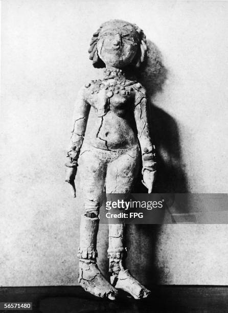 An Egyptian doll from approximately 900 BC made from paper and wax, mid 20th Century. It is supposed that this was a toy doll for children to play...