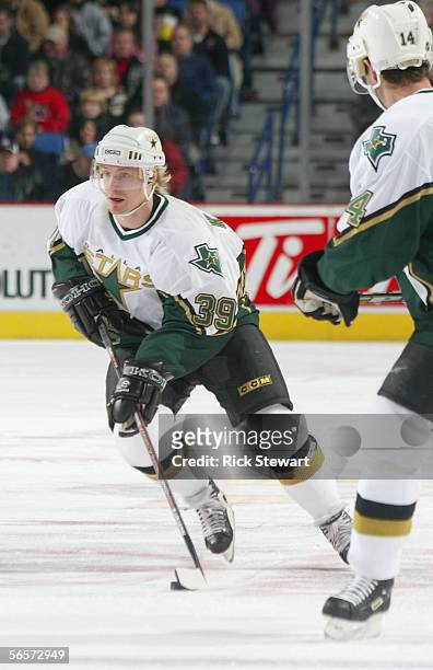 Niko Kapanen of the Dallas Stars skates with the puck against the Buffalo Sabres during the NHL game on December 14, 2005 at HSBC Arena in Buffalo,...